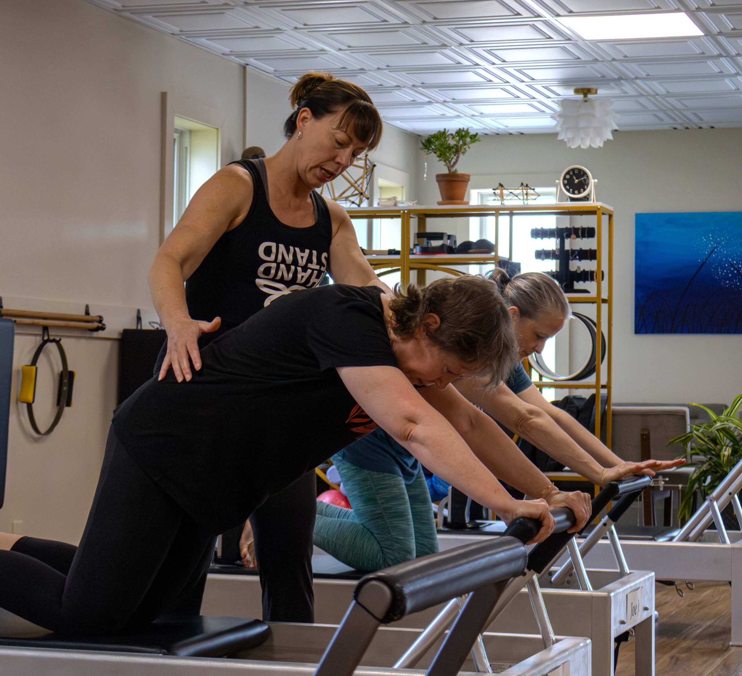Reformer Knee Stretch Eau Claire Pilates Classes